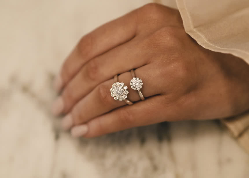 Halo engagement ring with lab-grown diamonds shaped like a flower in gold